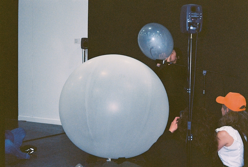 speakers under a balloon